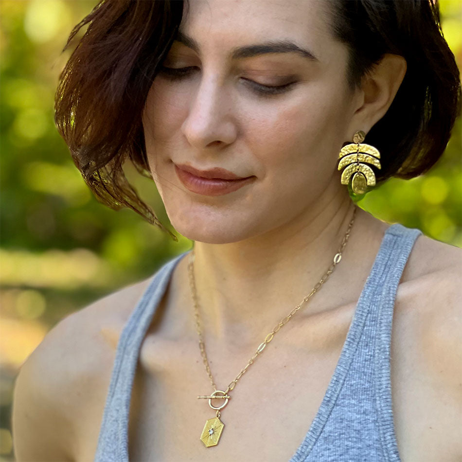 Fair Trade ethically made brass earrings India on model