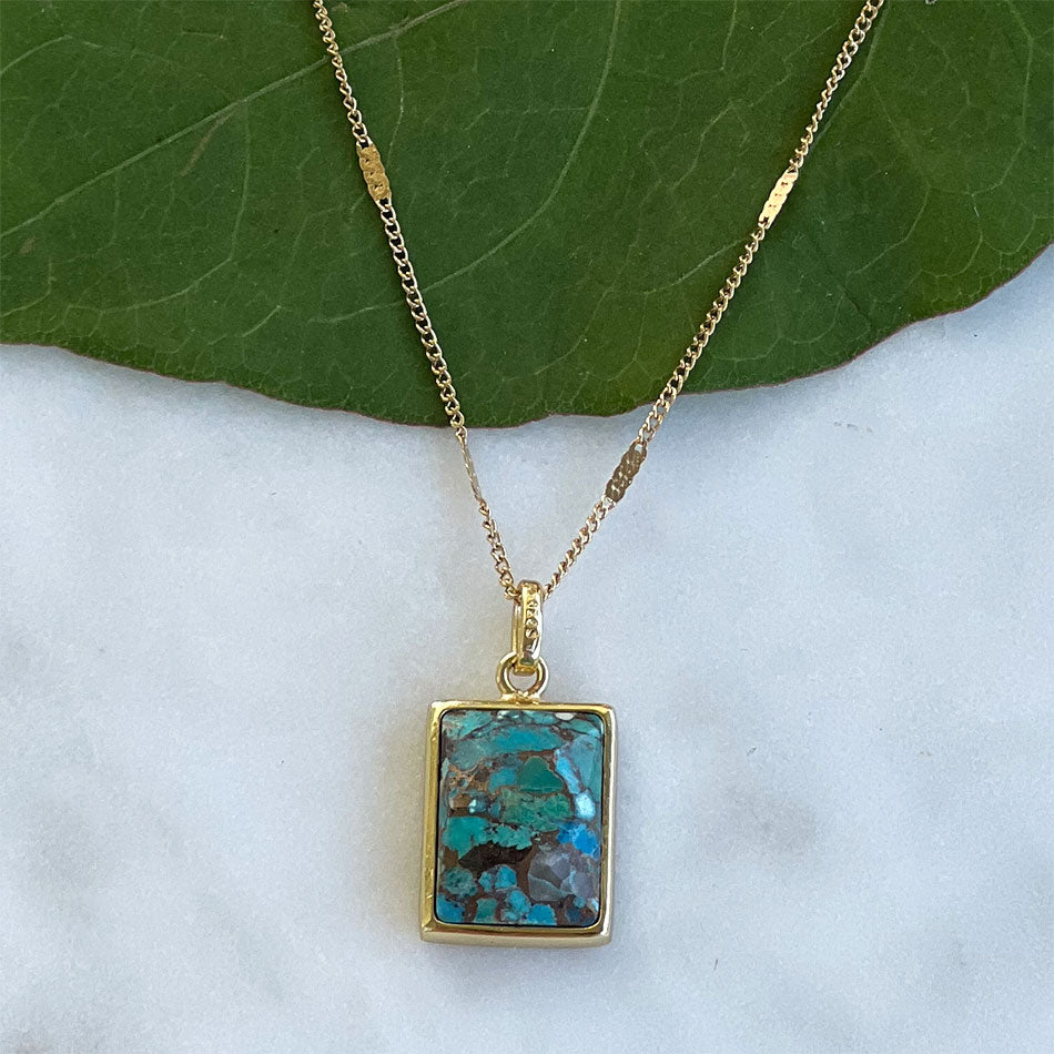 Fair trade turquoise necklace handmade by survivors of human trafficking