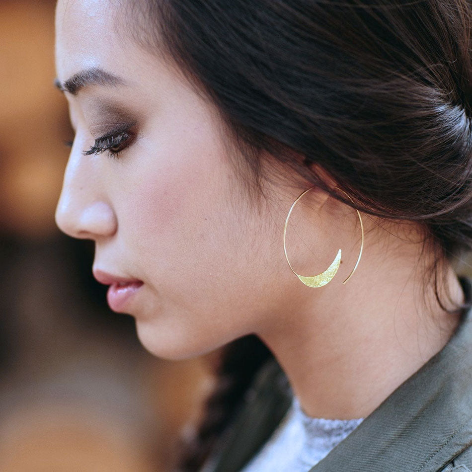 Fair trade brass earrings handmade by survivors of human trafficking