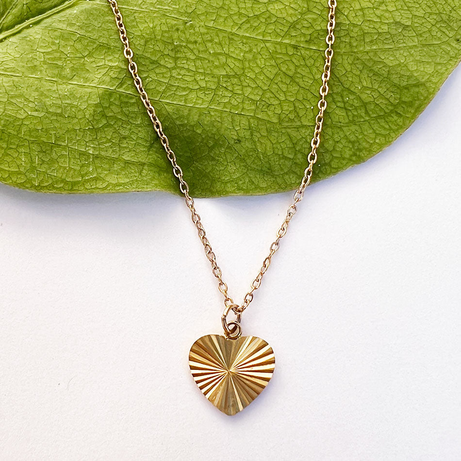 Fair trade gold heart necklace handmade by survivors of human trafficking