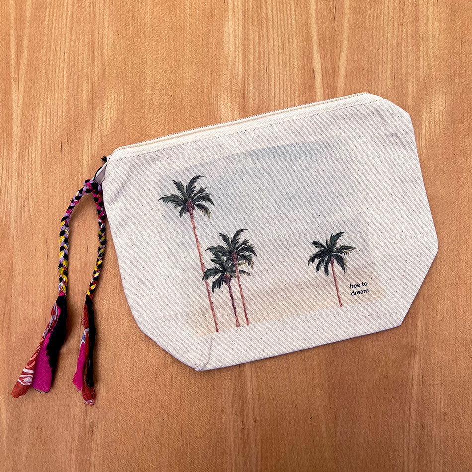 Fair trade organic cotton pouch handmade by human trafficking survivors.