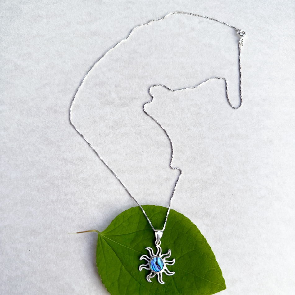 Sterling silver sun pendant with abalone in the center