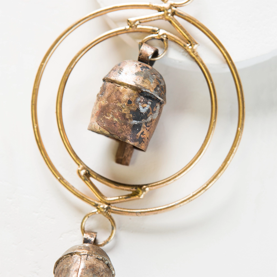 Copper-plated wind chime with 2 circles and 2 bells.