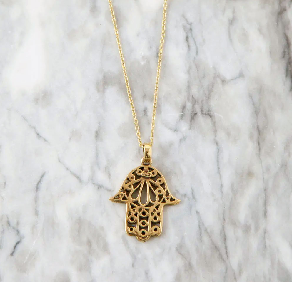 Fair trade brass hamsa necklace
