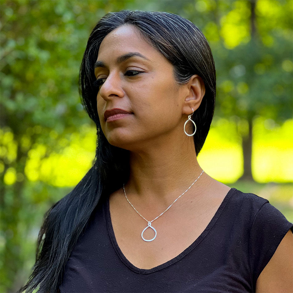 Ethically handmade sterling silver hoop earrings Bali on model