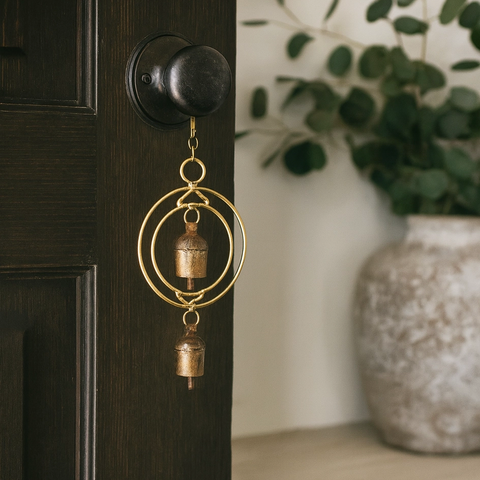 Copper-plated wind chime with 2 circles and 2 bells.