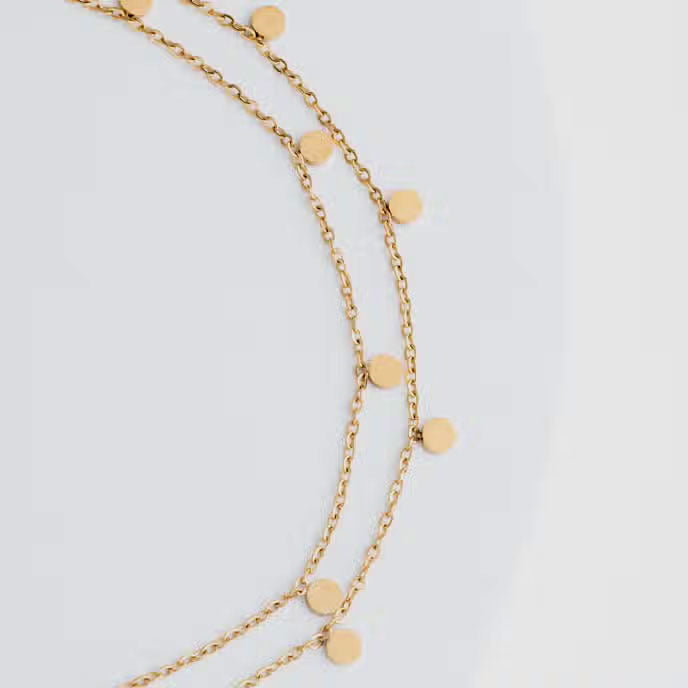 Gold necklace ethically handmade by survivors of human trafficking
