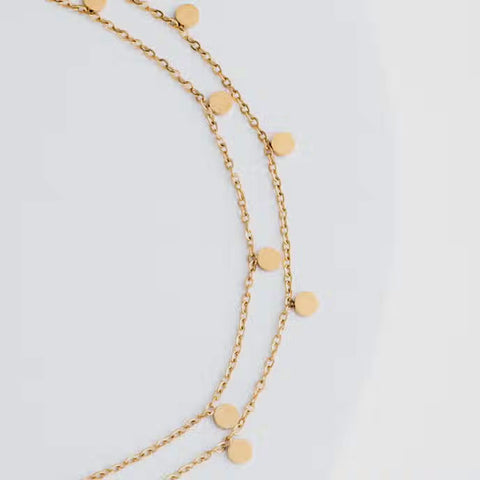 Fair trade gold necklace handmade by survivors of human trafficking