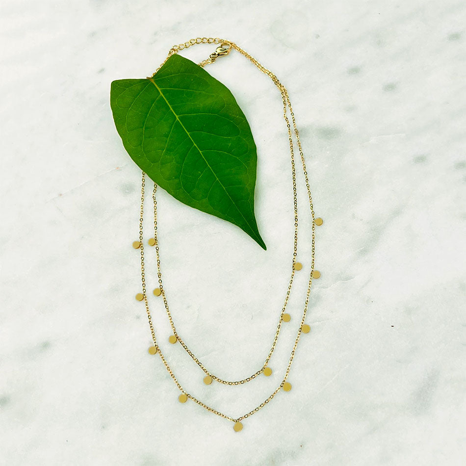 Fair trade gold necklace handmade by survivors of human trafficking