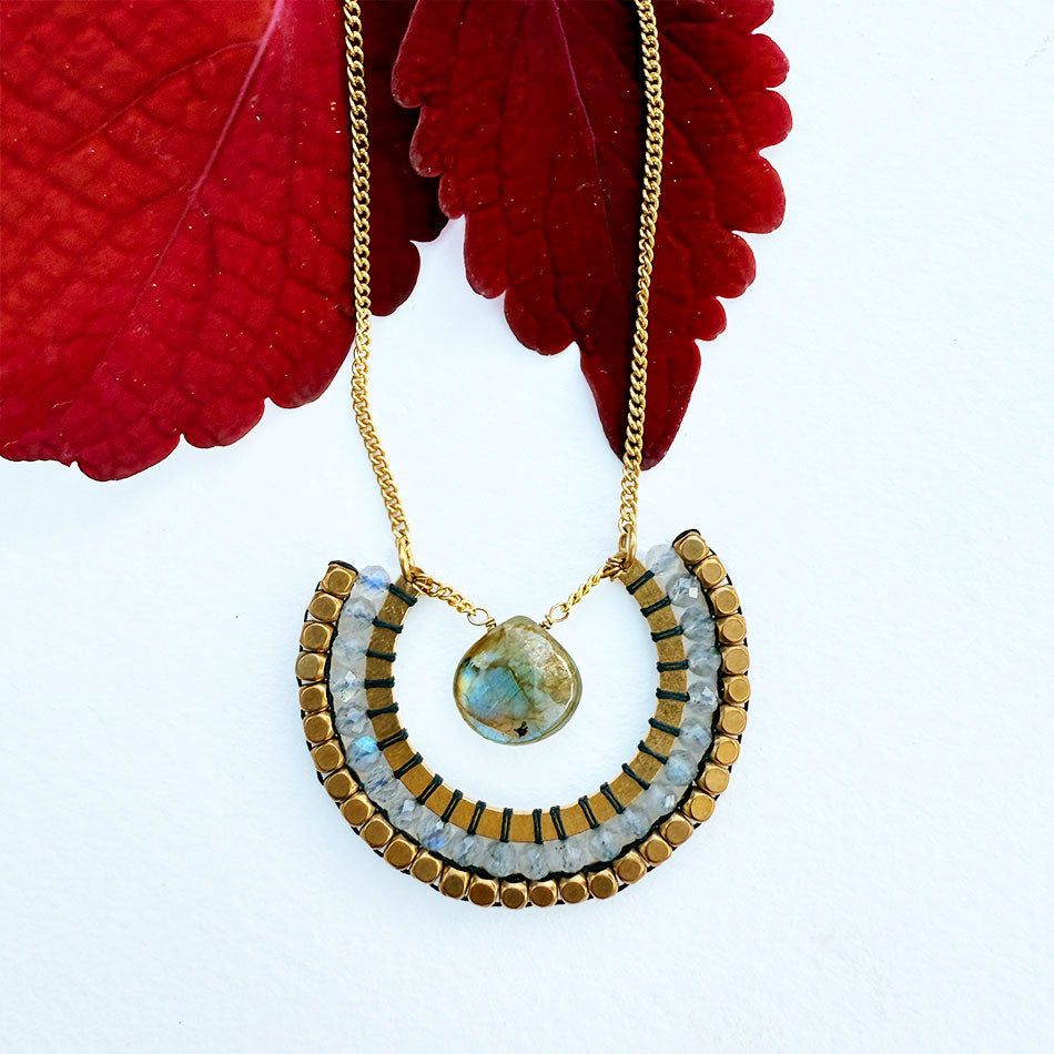 This fair trade necklace features labradorite and brass and is a statement piece.