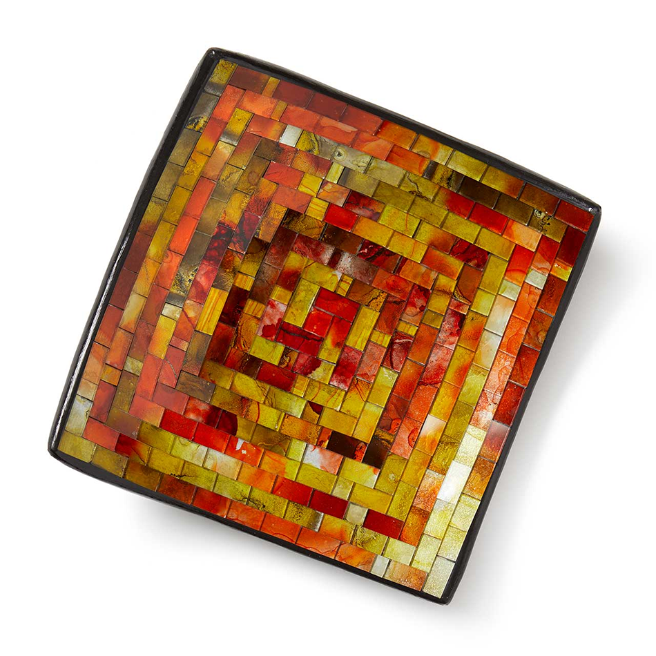 Square shallow bowl with orange, yellow and brown glass mosaic pattern.