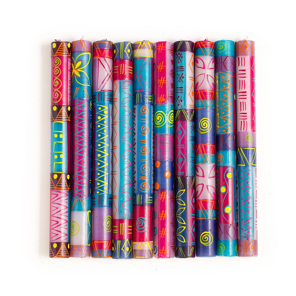 Several hand-painted dinner candles with pink, blue, white yellow design