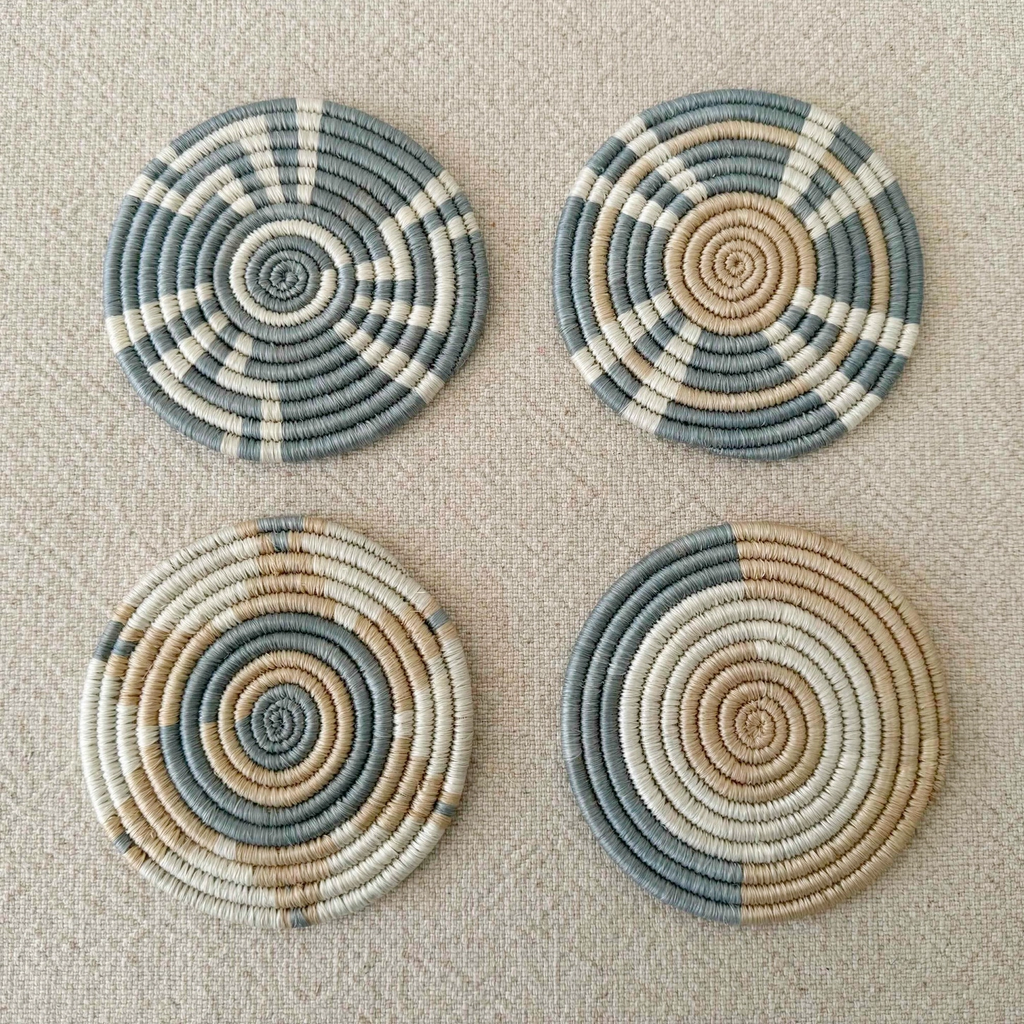 Set of 4 handwoven coasters round light blue tan white geometric pattern