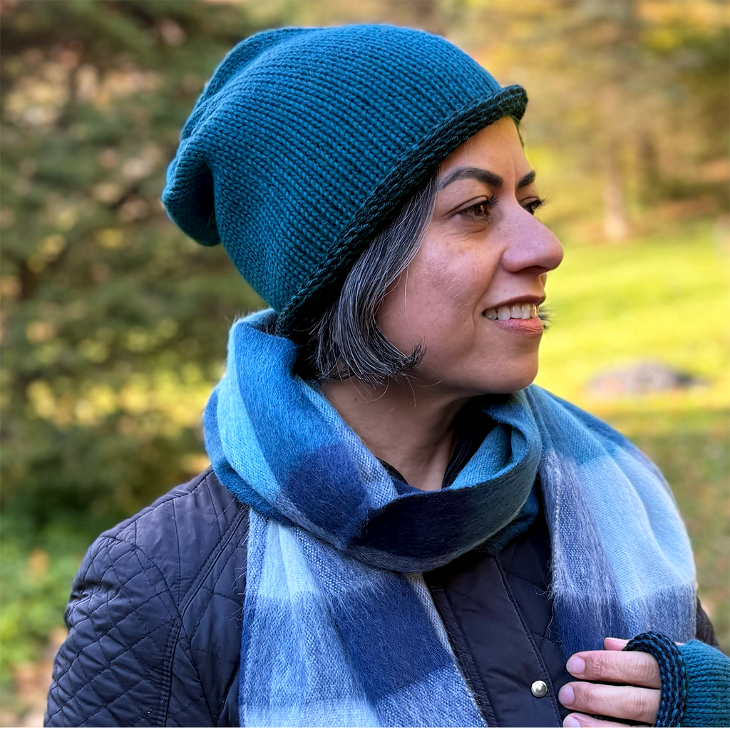 Alpaca beanie hat jade with black trim on model