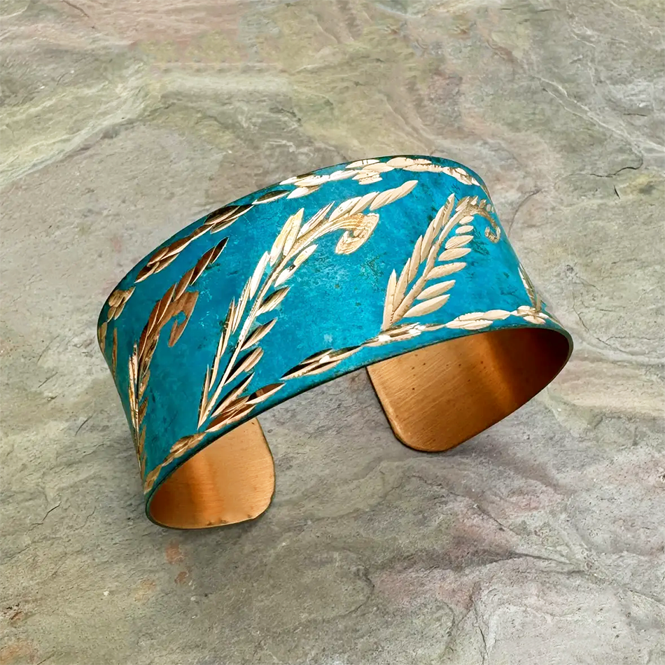 Bright blue copper cuff bracelet with gold leaves
