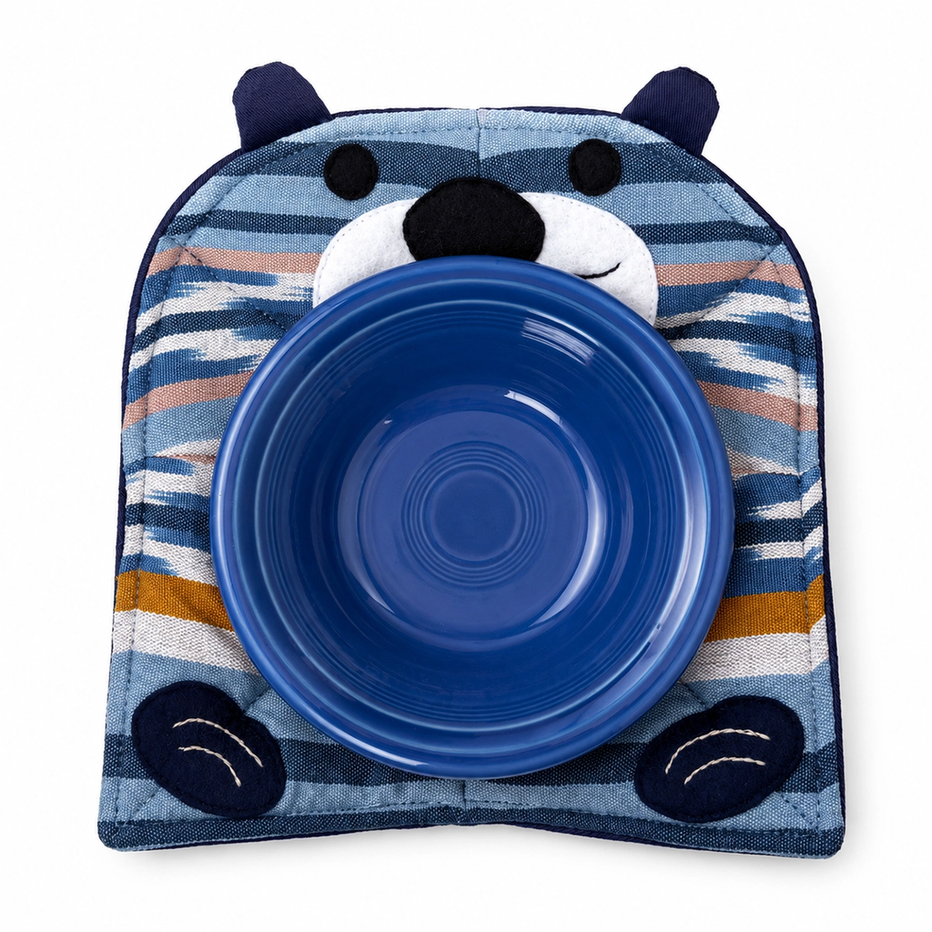 Cotton microwave cozy with sea otter design in blues, tans and white with blue bowl on top