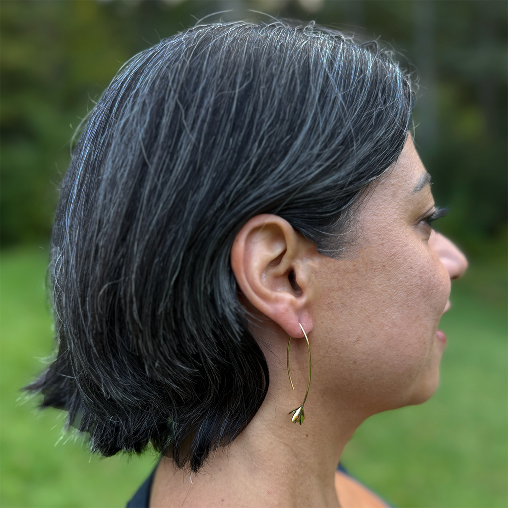 Brass earrings with long gold wire and flower on the bottom