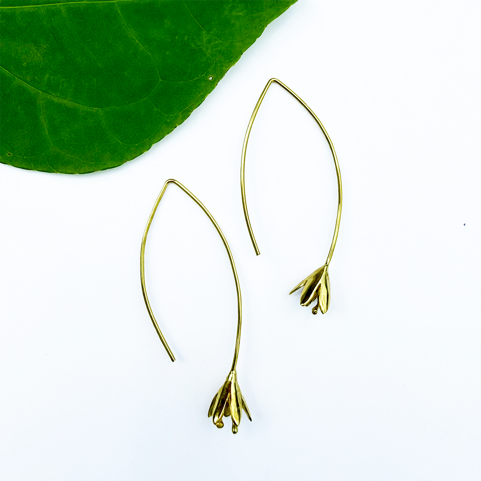 Brass earrings with long gold wire and flower on the bottom