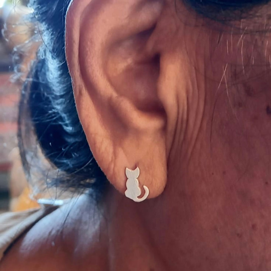 Sterling silver cat post earrings on model
