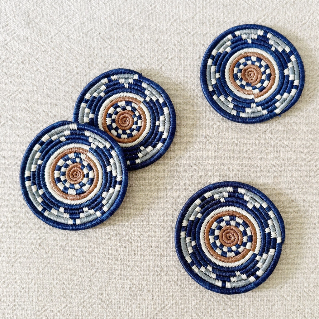 Set of 4 handwoven coasters round blue tan white geometric pattern
