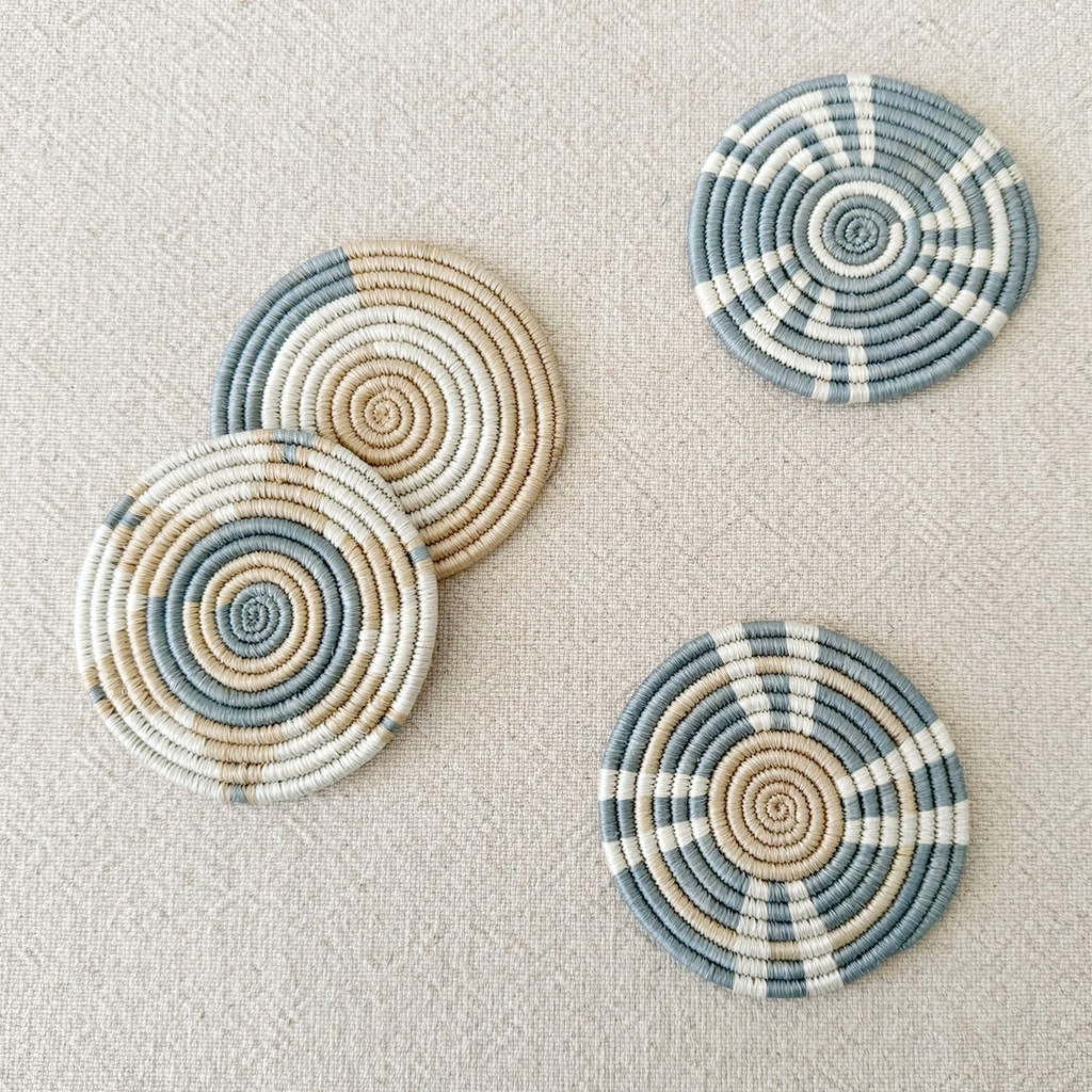 Set of 4 handwoven coasters round light blue tan white geometric pattern