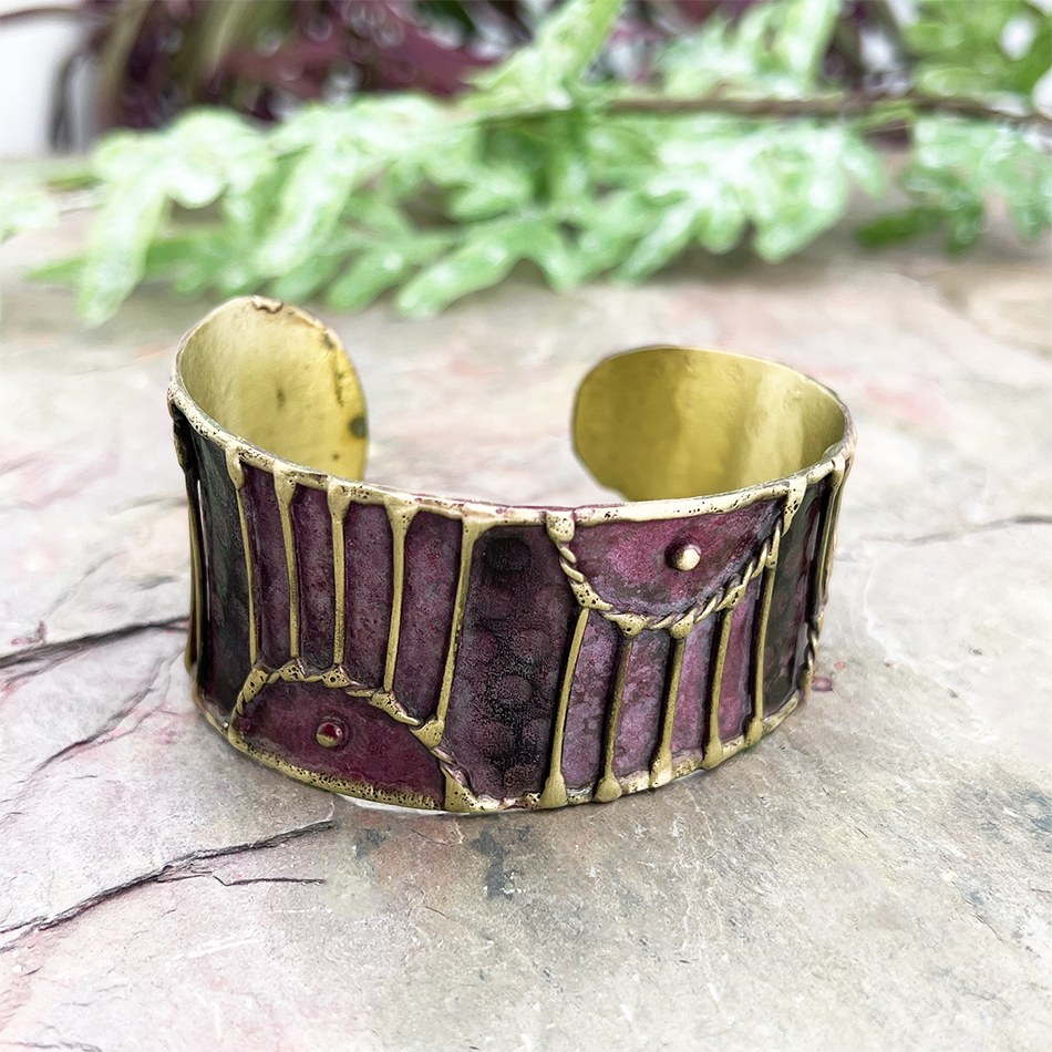 Brass wide cuff with plum patina and brass design