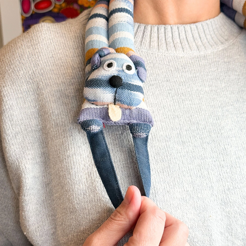 Neck wrap warmer with stripes and dog design on model