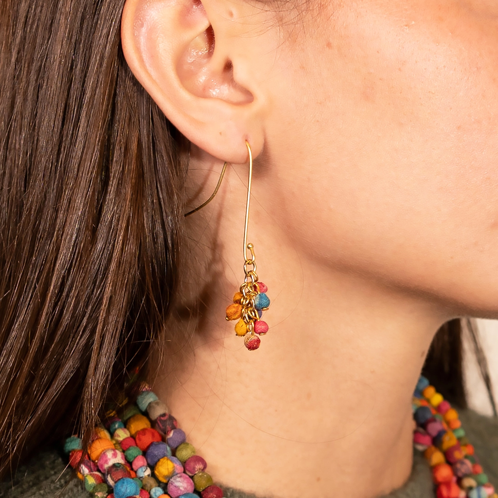 Earrings with long brass wire and a cluster of colorful sari beads on the bottom