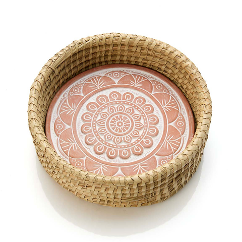 Basket with ceramic bread warmer inside with mandala design.