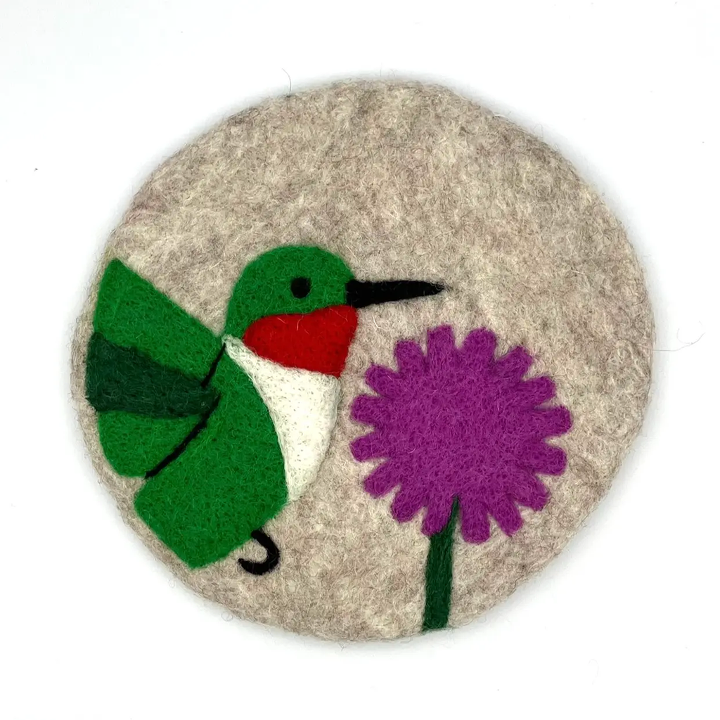 Round felt trivet with hummingbird and flower design on top