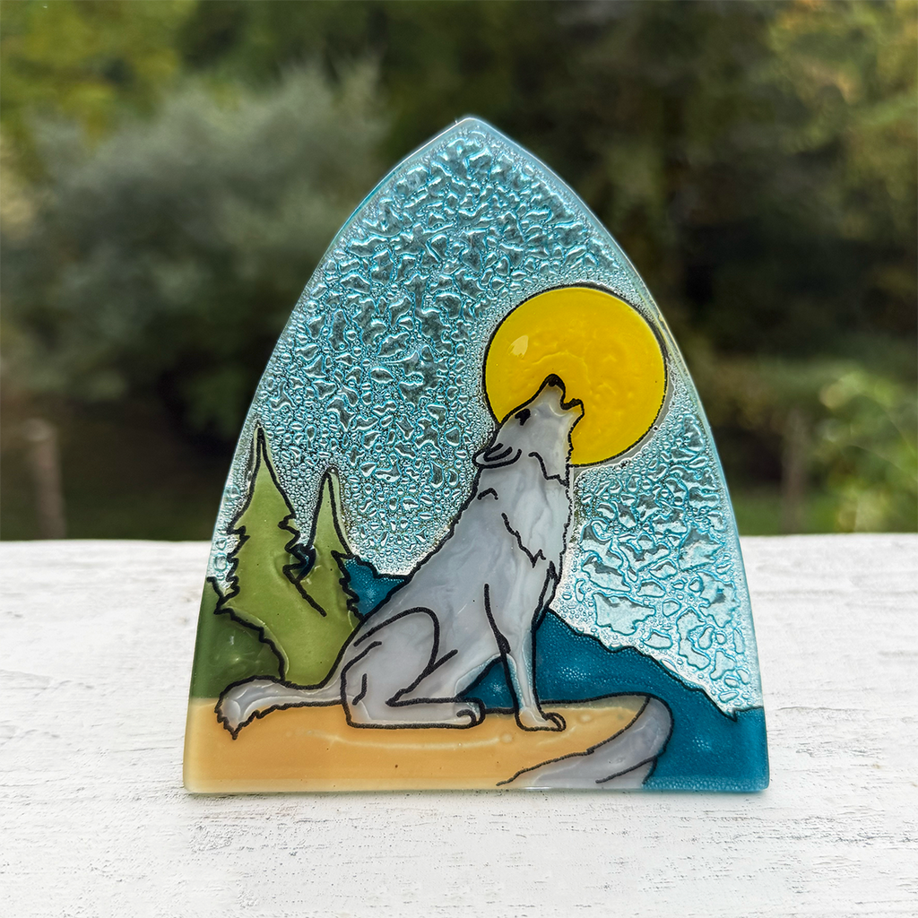 Glass nightlight with wolf howling at a yellow moon