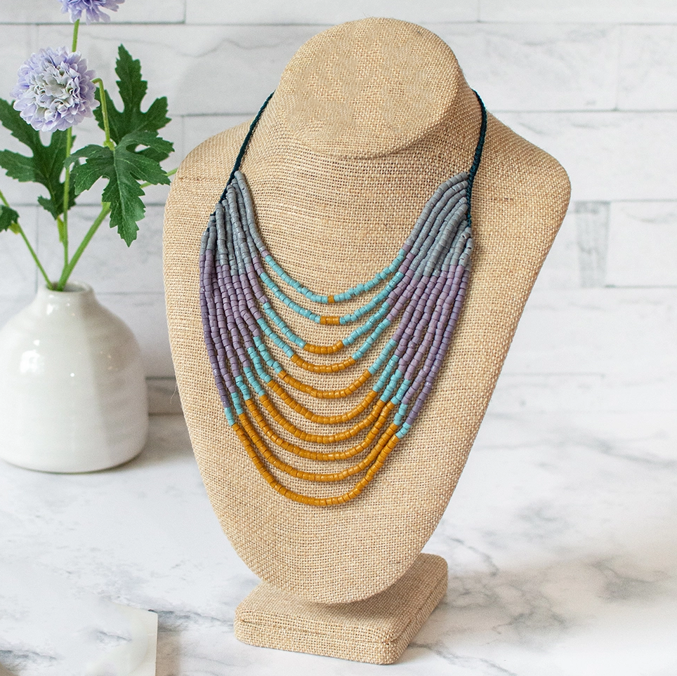 Glass statement necklace several strand of beads in gold, purple and blue
