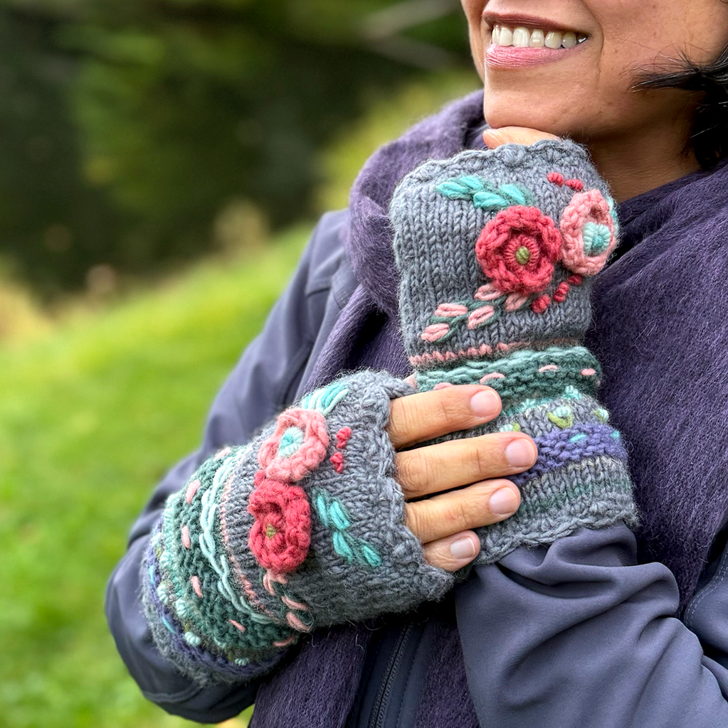 Wool fingerless gloves gray with embroidered flowers on model