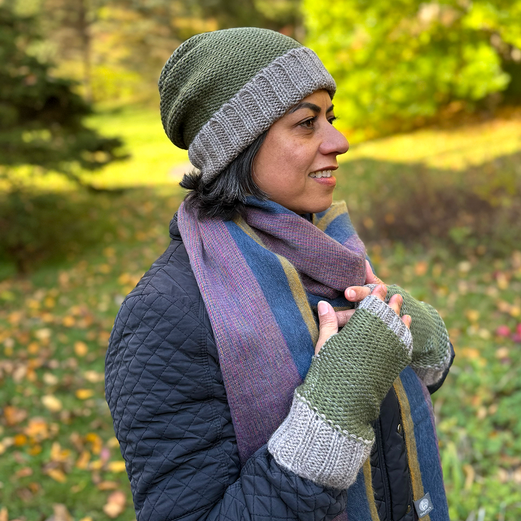 Baby alpaca fingerless gloves and hat olive green and gray on model
