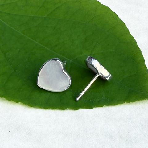 Mother-of-pearl heart studs in sterling silver casing