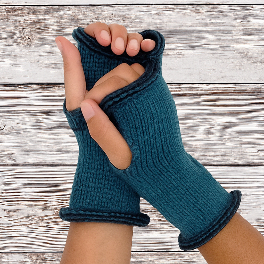 Knitted baby alpaca fingerless gloves on hands, teal with black trim

