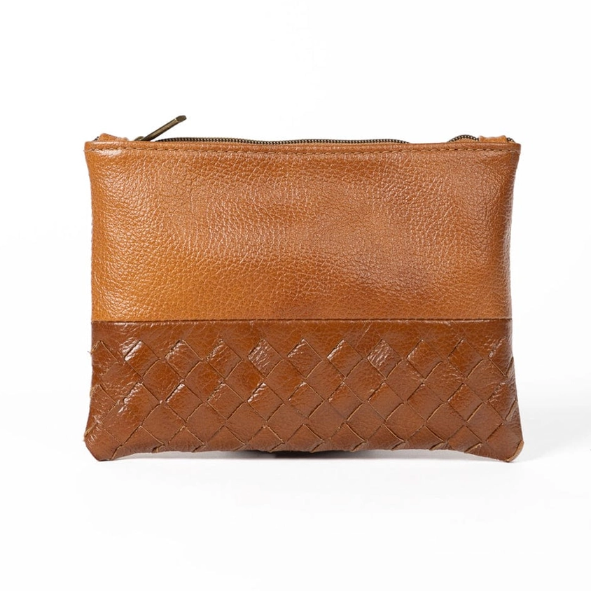 Light brown leather pouch with woven design on front.