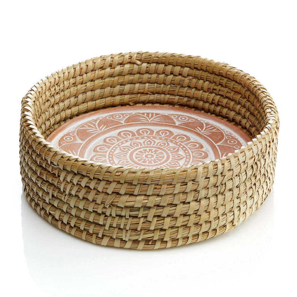 Basket with ceramic bread warmer inside with mandala design.