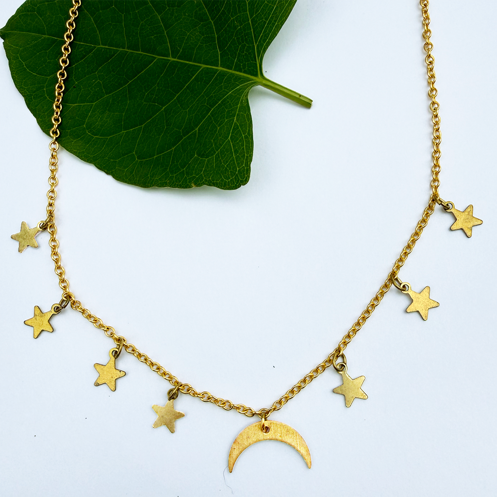 Brass necklace with delicate chain and moon and stars charms.
