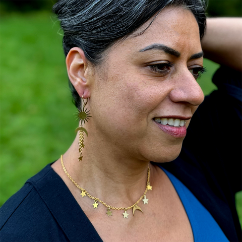 Brass necklace with delicate chain and moon and stars charms.