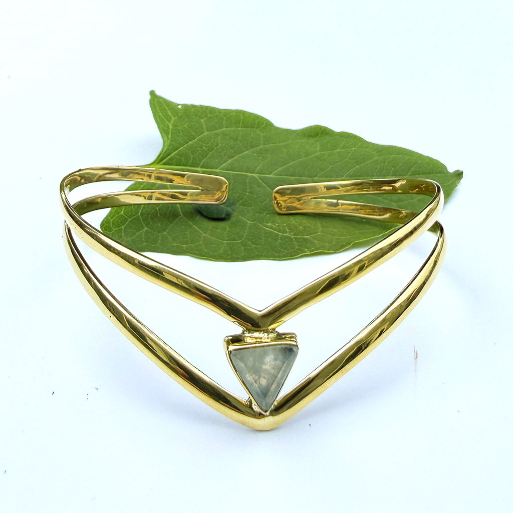 Double chevron shaped brass bracelet with moonstone triangle in center