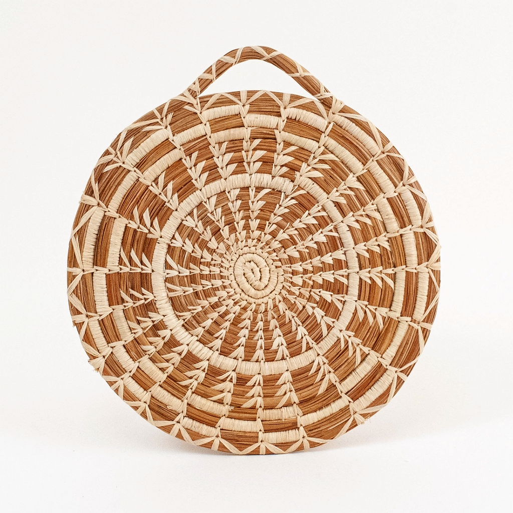 Handwoven pine needle round trivet with handle