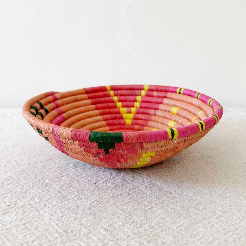 Side view of basket with orange pink yellow design