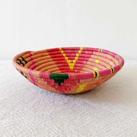 Round handwoven basket orange pink black yellow