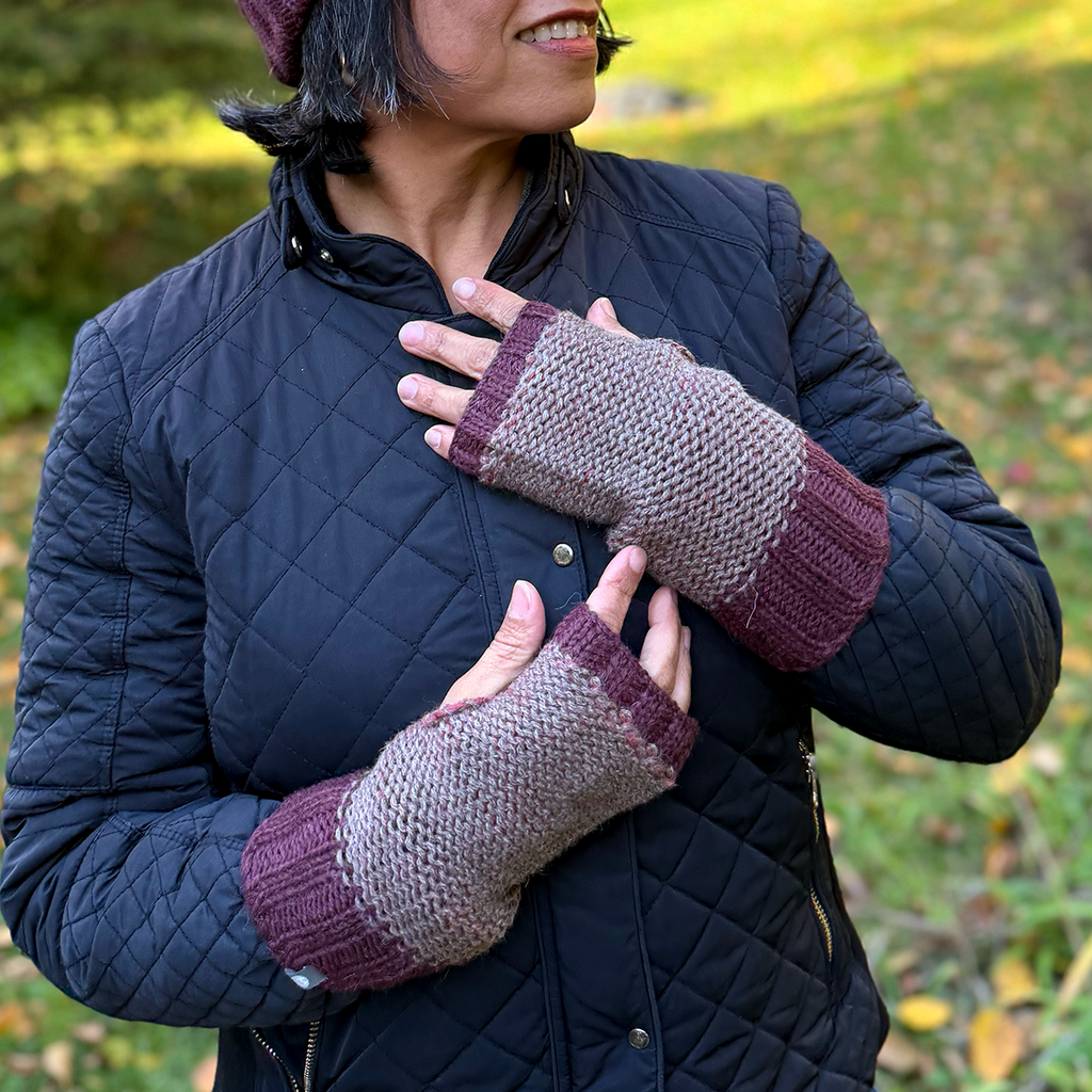 Model with gray and purple alpaca fingerless gloves
