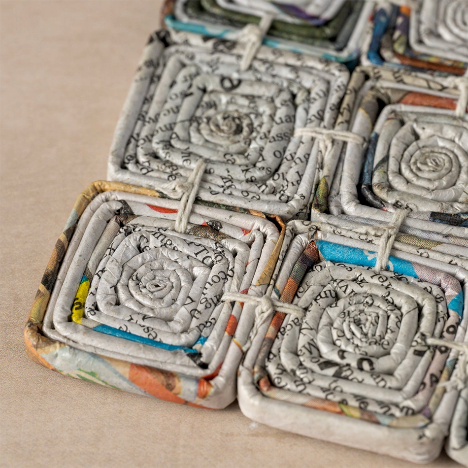 Square trivet made of recycled newspaper