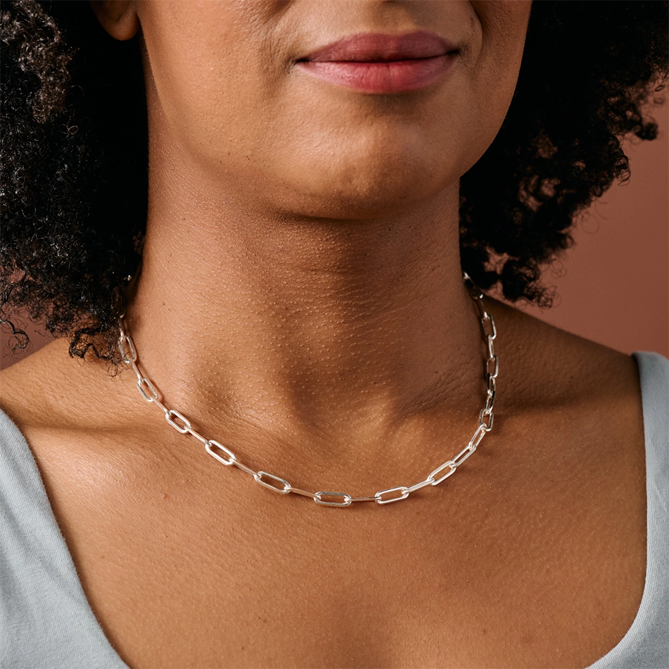 Silver-plated chain link necklace on model