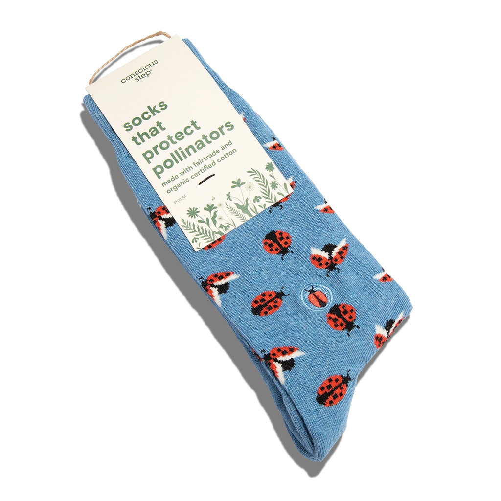 Sky blue socks with ladybugs and pollinator tag