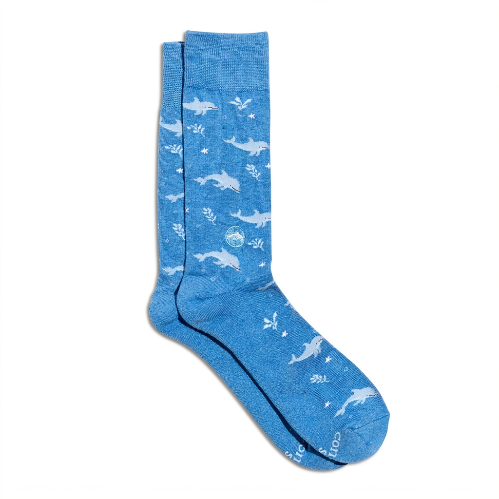 Blue socks with white dolphins all over them