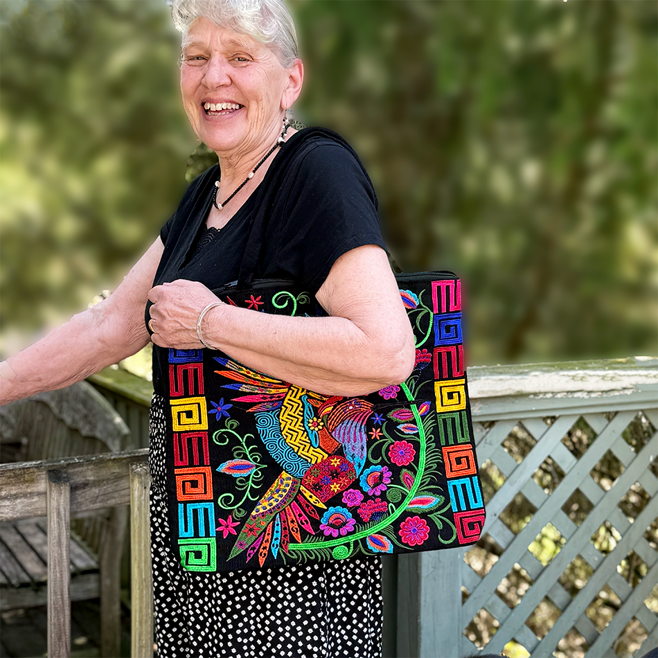 Large black cotton tote bag with detailed embroidery of birds, colorful.